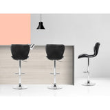 Four Artiss black gas lift bar stools in contemporary kitchen — Allure Home Collections