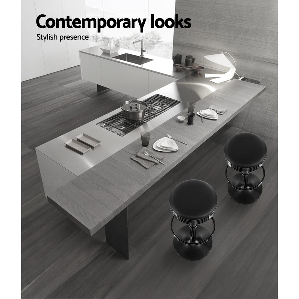 Two Artiss black gas lift bar stools at kitchen counter — Allure Home Collections