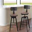 Tooradin black industrial swivel bar stool with elm wood seat in a modern kitchen
