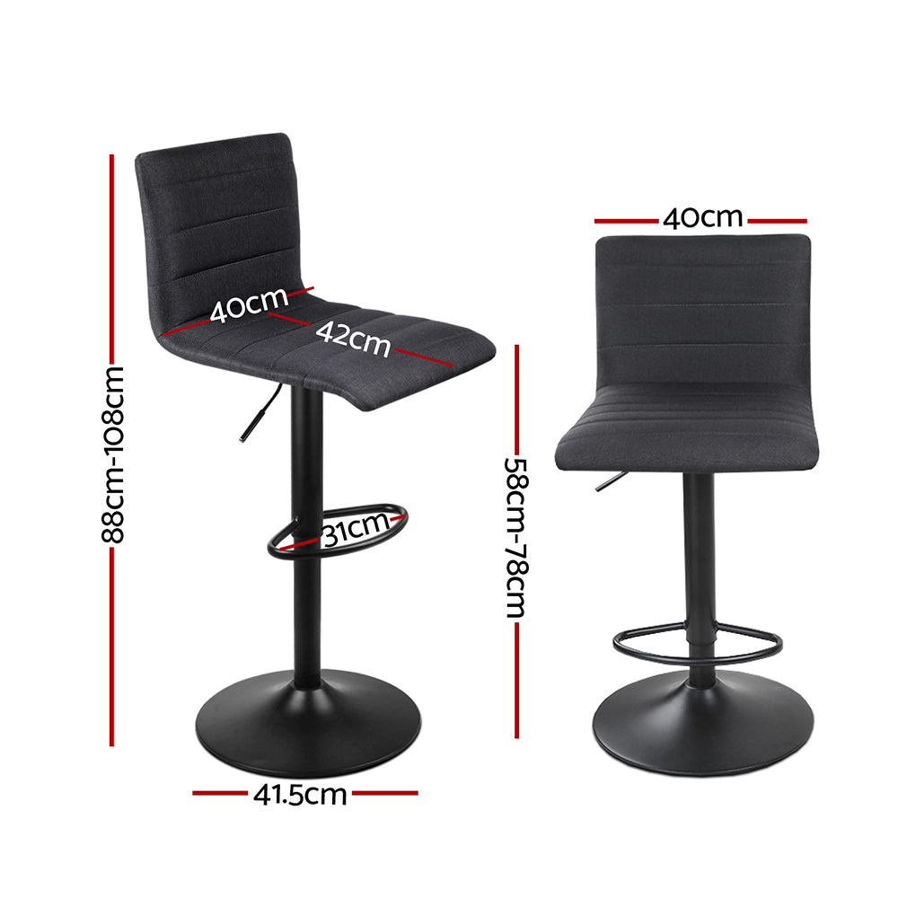Ryanston linen gas lift bar stool black beside a kitchen island