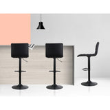 Set of 4 Artiss black linen gas lift bar stools at kitchen counter — Allure Home Collections