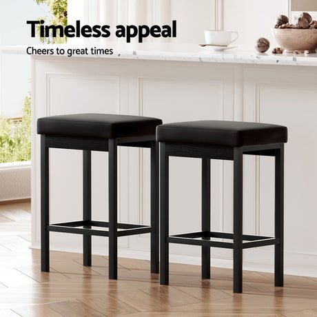 Four Artiss metal bar stools in contemporary dining setting — Allure Home Collections
