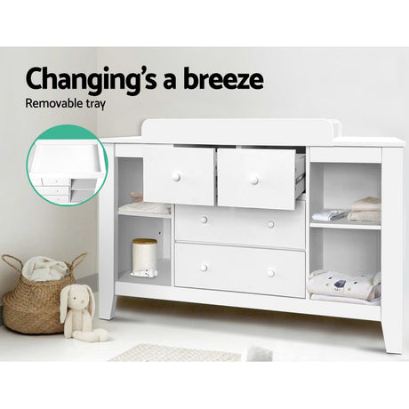 White baby change table with four drawers and four open shelves