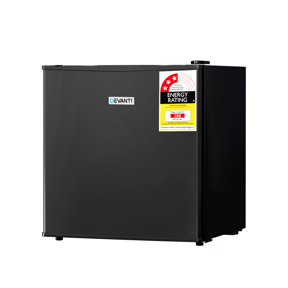 Black bar fridge shown in an office or home bar setting