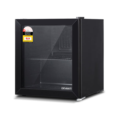 Black bar fridge shown in a home bar setting