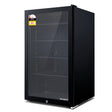 98 L glass door bar fridge in a home bar or cafe setting