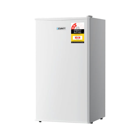 95 L white bar fridge stocked with drinks in a home bar setting