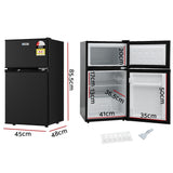 85 L black bar fridge shown at an angle with door closed