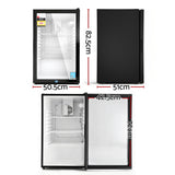Bar fridge front view with glass door closed and LED interior light on