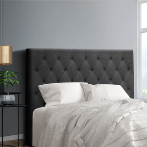Cooma charcoal faux linen button tufted double bed head in a bedroom