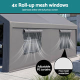 Car parked under the grey carport canopy shelter