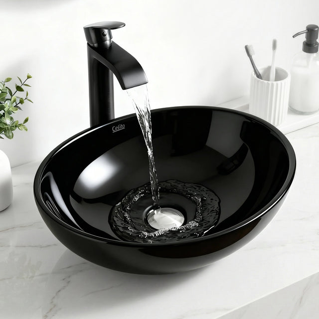 Oval ceramic vessel basin in high gloss black, 41cm above counter basin