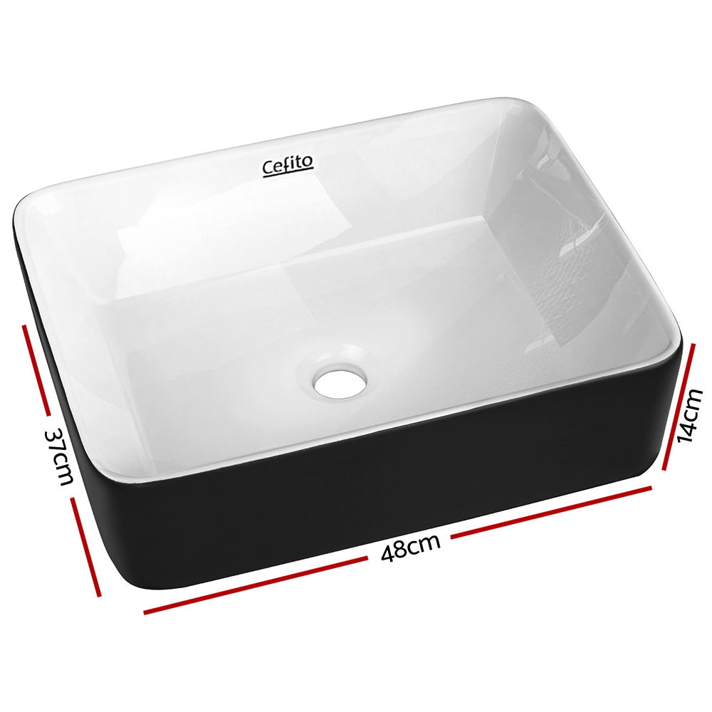 Two tone matte black and gloss white oval ceramic basin, front view, 48x37cm