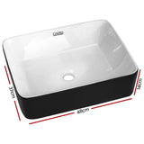 Two tone matte black and gloss white oval ceramic basin, front view, 48x37cm