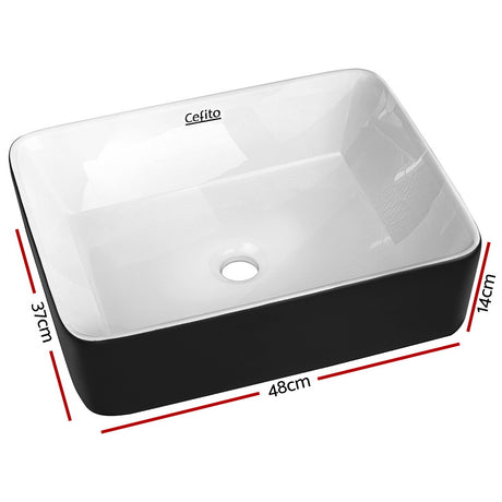 Two tone matte black and gloss white oval ceramic basin, front view, 48x37cm