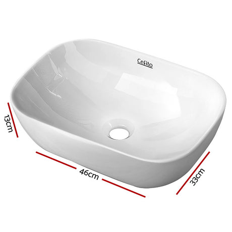 White high gloss oval ceramic above counter basin, front view, 46x33cm
