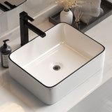 White above counter ceramic wash basin with black line, angled view
