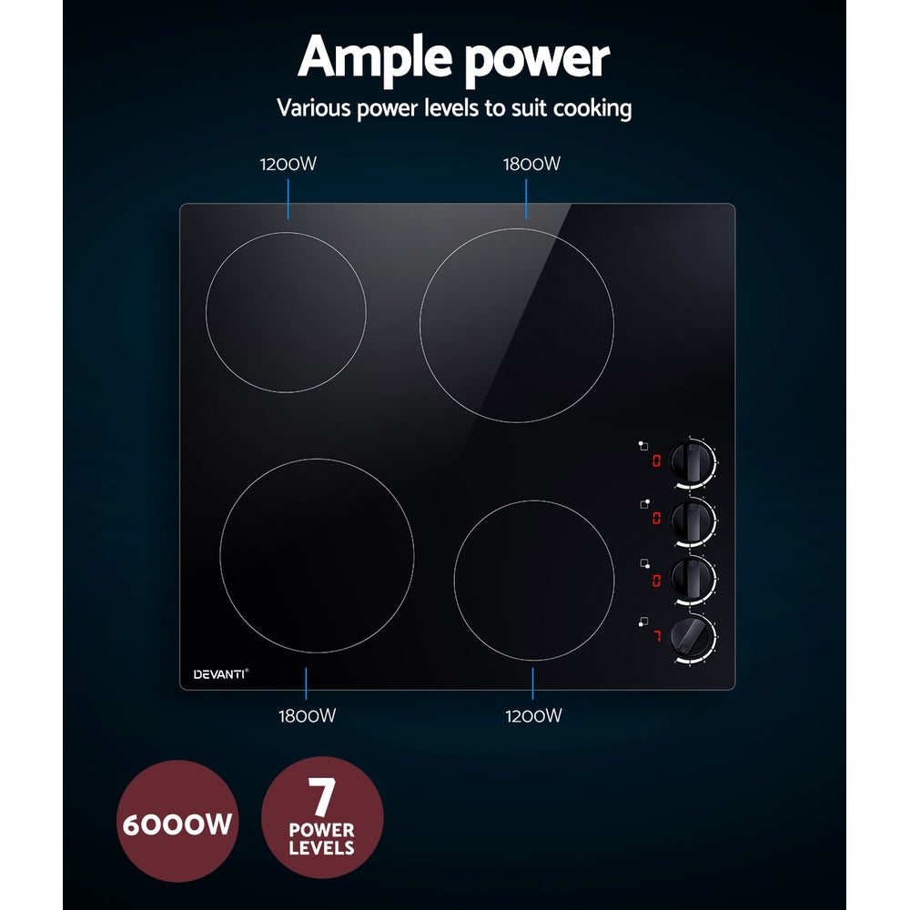Underside of the cooktop showing heating elements and cooling fan