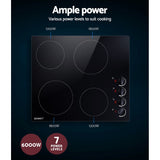 Underside of the cooktop showing heating elements and cooling fan