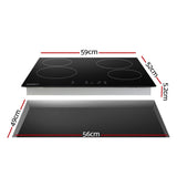 Four cooking zone markings on the black ceramic glass surface