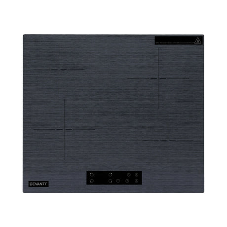 Grey ceramic cooktop installed flush in a kitchen benchtop