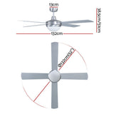 Silver ceiling fan with four plywood blades mounted in a lounge room