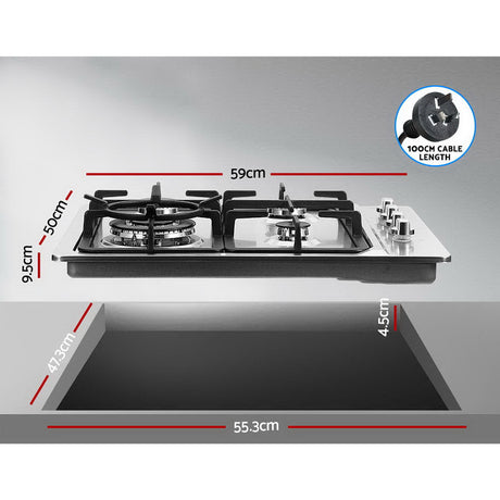 Silver gas cooktop fitted into a kitchen benchtop with cookware in use