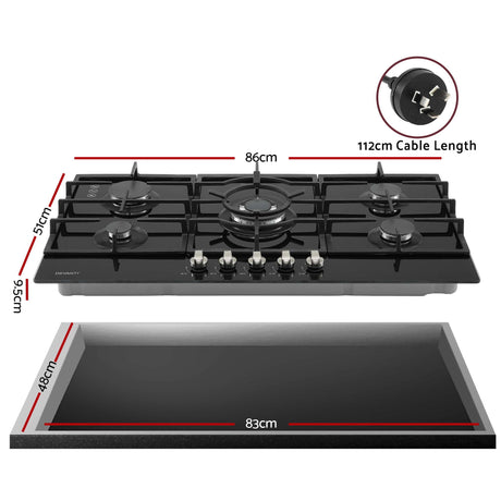 Black glass gas cooktop shown at an angle with cast iron pan supports