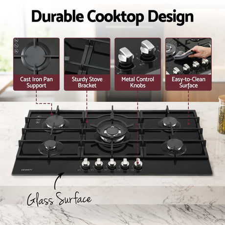 Burners lit on the 90 cm black tempered glass gas cooktop