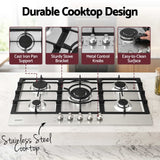 Burners lit on the 90 cm stainless steel gas cooktop