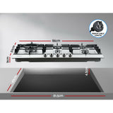 Wide silver gas cooktop installed in a kitchen benchtop with pots in use