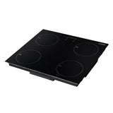 Top view of four 18 cm induction cooking zones on the black glass plate