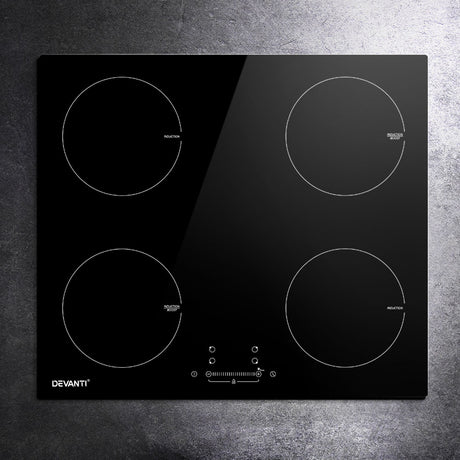 Detail of child lock, timer and boost function controls on the induction cooktop