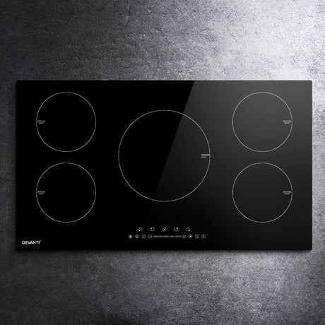 Detail of child lock, boost and 99 minute timer controls on the induction cooktop
