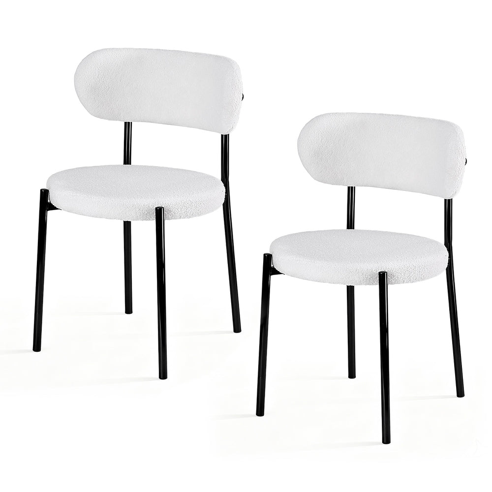 Stirling white sherpa boucle dining chairs with curved backrest in a modern dining room