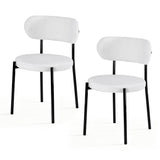 Stirling white sherpa boucle dining chairs with curved backrest in a modern dining room