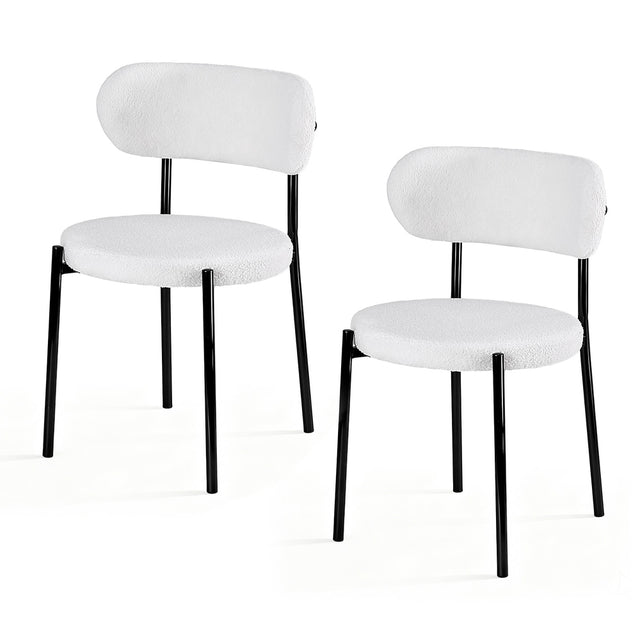 Stirling white sherpa boucle dining chairs with curved backrest in a modern dining room