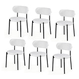 Stirling white sherpa boucle dining chairs with curved backrest in a modern dining room