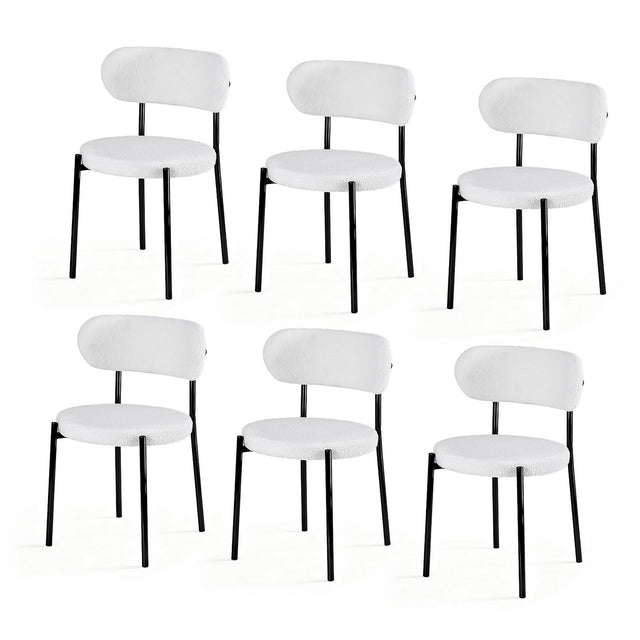 Stirling white sherpa boucle dining chairs with curved backrest in a modern dining room