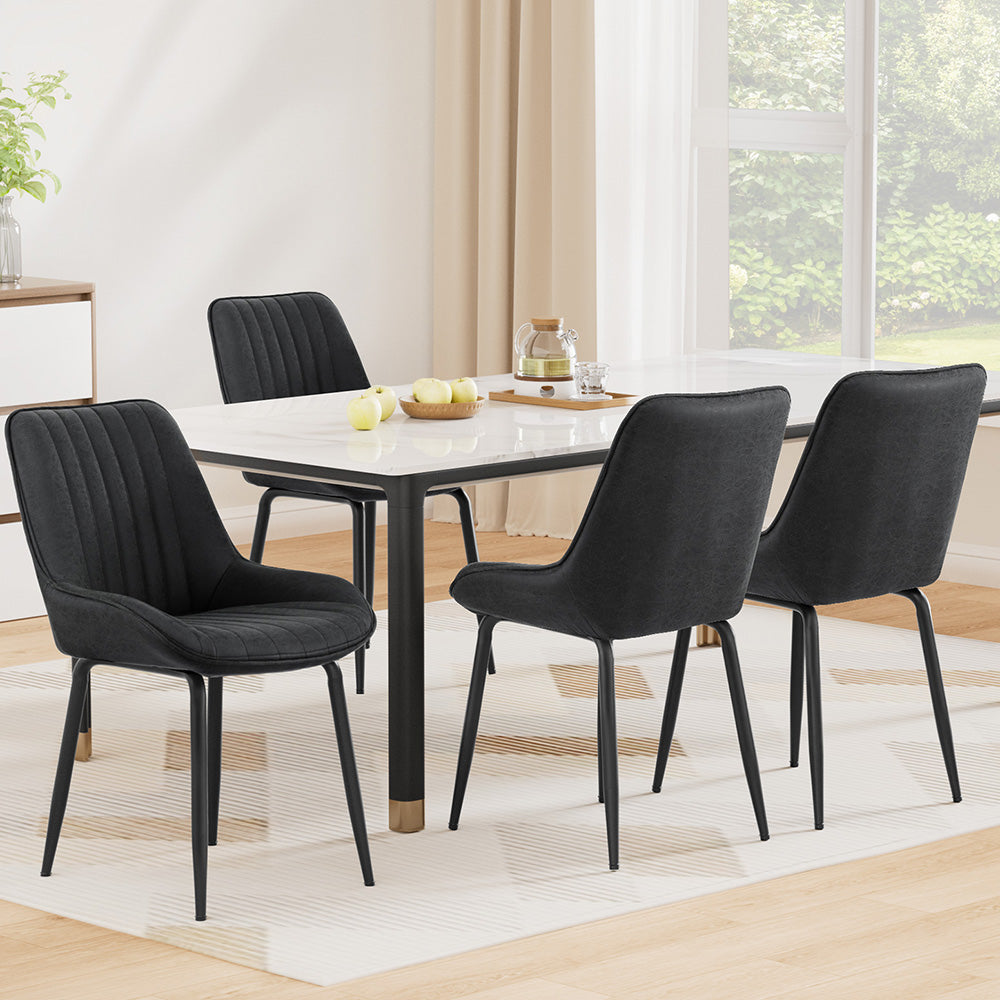 Nain black faux leather dining chair with metal legs in a modern dining room