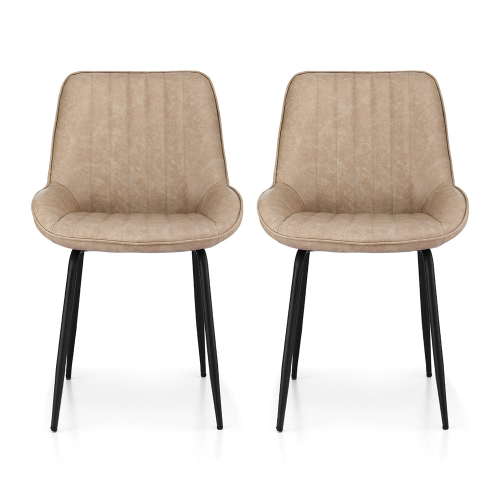 Nain khaki faux leather dining chair with black metal legs in a modern dining room