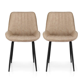 Nain khaki faux leather dining chair with black metal legs in a modern dining room