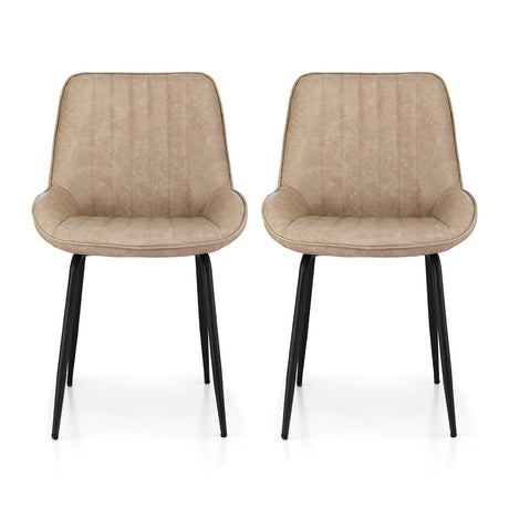 Nain khaki faux leather dining chair with black metal legs in a modern dining room