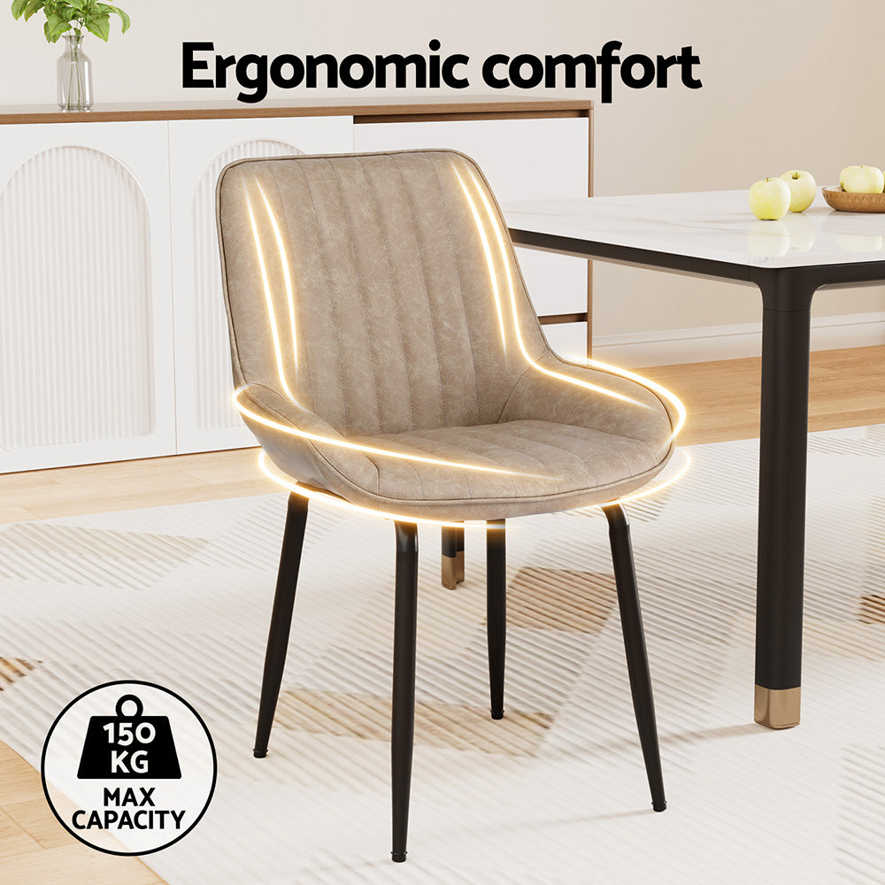 Nain khaki faux leather dining chair with black metal legs in a modern dining room