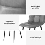 Krondorf grey faux leather dining chair in a modern dining room