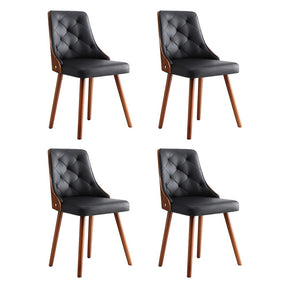 Houghton black faux leather diamond tufted dining chairs in a dining room