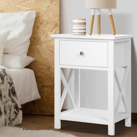 Nashua white one drawer bedside table with lower shelf in a rustic styled bedroom