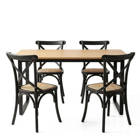 Woodside black rattan dining set in a modern dining room
