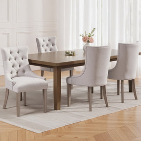 Summertown beige linen French Provincial tufted dining chairs with solid wood legs in a dining room