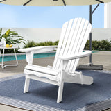 White timber adirondack chair in a garden setting